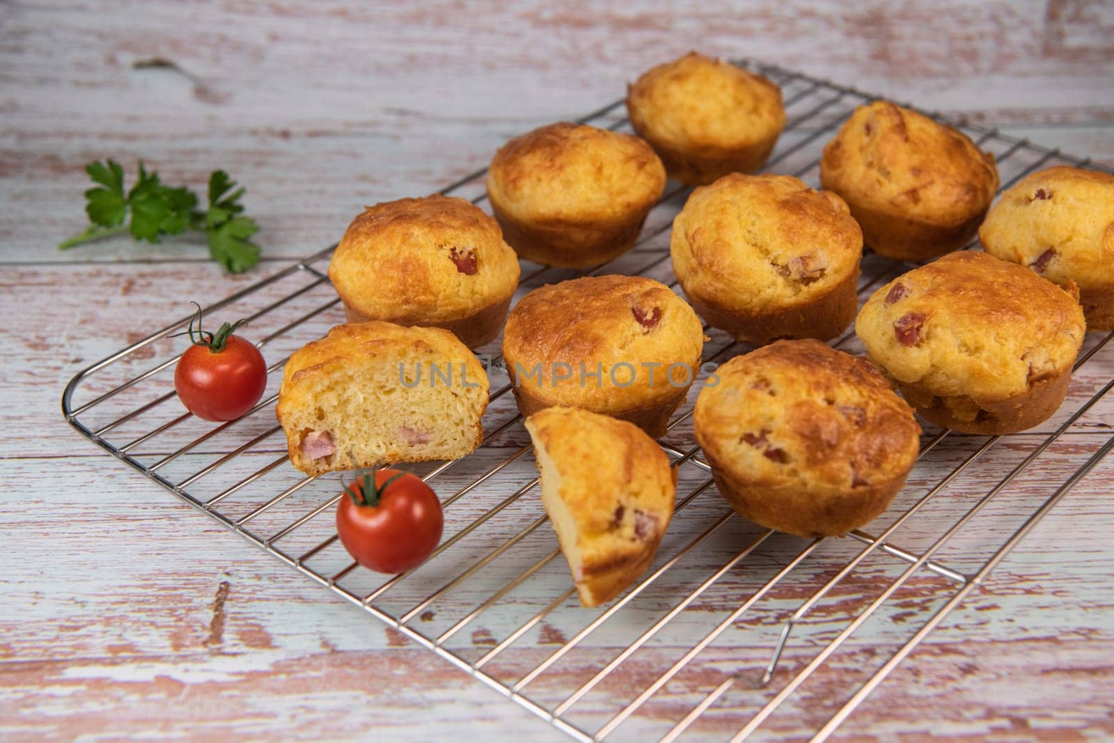 Savory muffin with ham and cheese on blue background, High quality photo