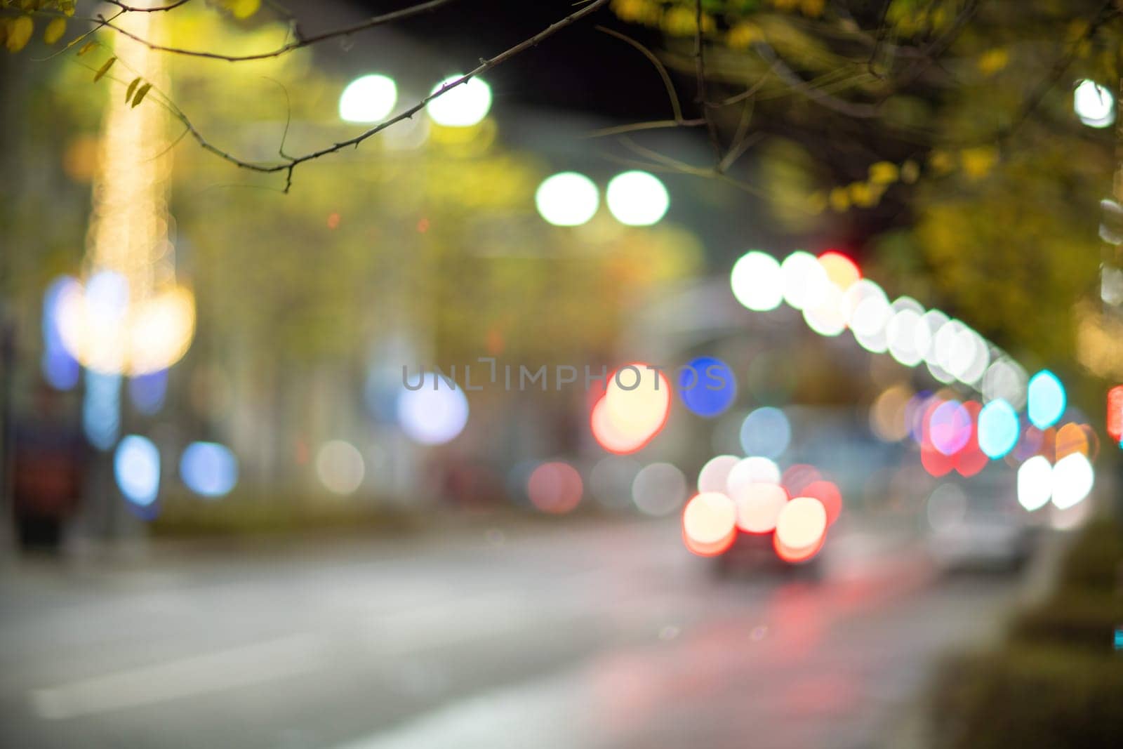 Blurred footage of transport. Blur of city lights along the road, light out of focus at night. Night city traffic, beautiful background