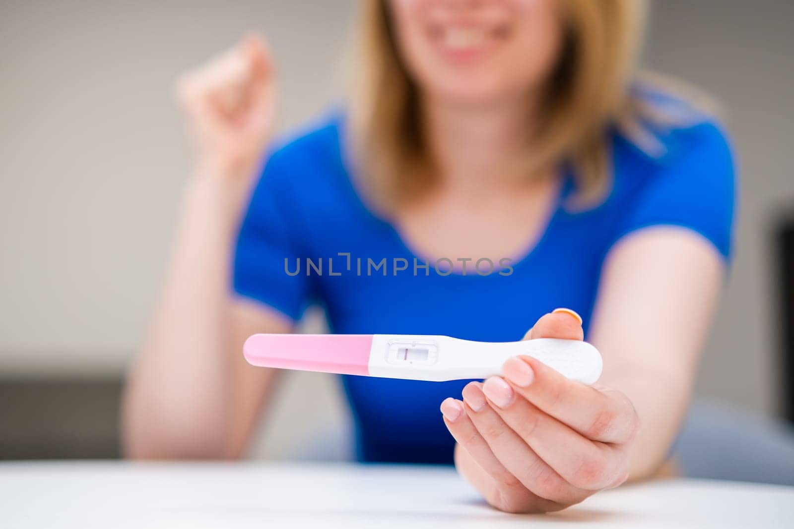 Say yes getting a negative pregnancy test. Happy young woman not ready to have a baby