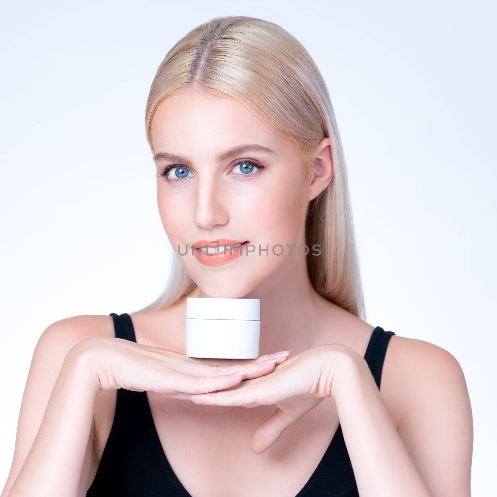 Closeup personable perfect skin woman holding mockup moisturizer jar. by biancoblue