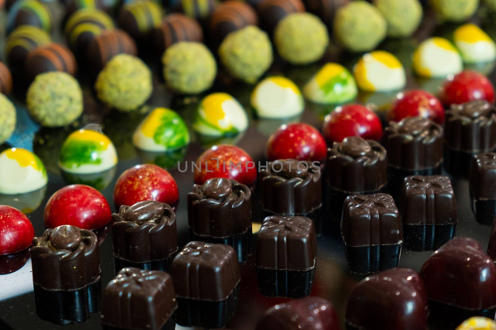 Colorful chocolate candies with different flavors. Exclusive delicious handmade sweets by vladimka