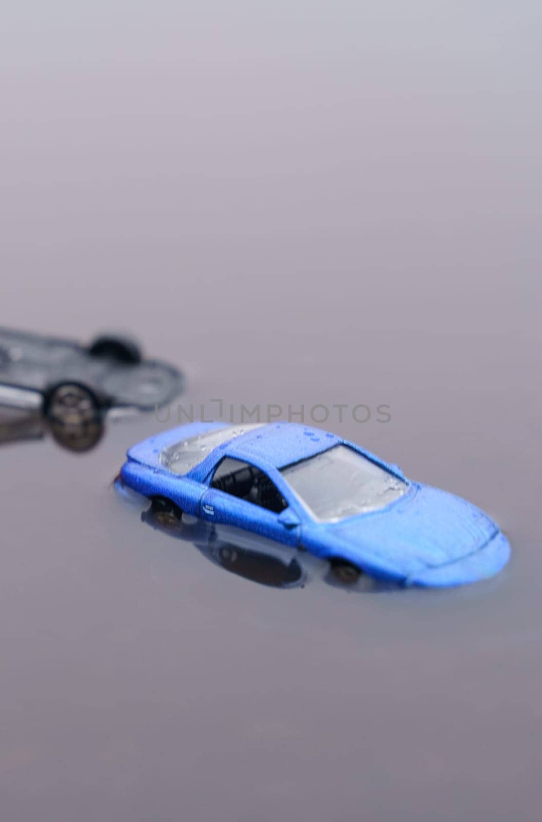 Two cars were flooded, one overturned as a result of the flood. One of them is out of focus. by Sd28DimoN_1976