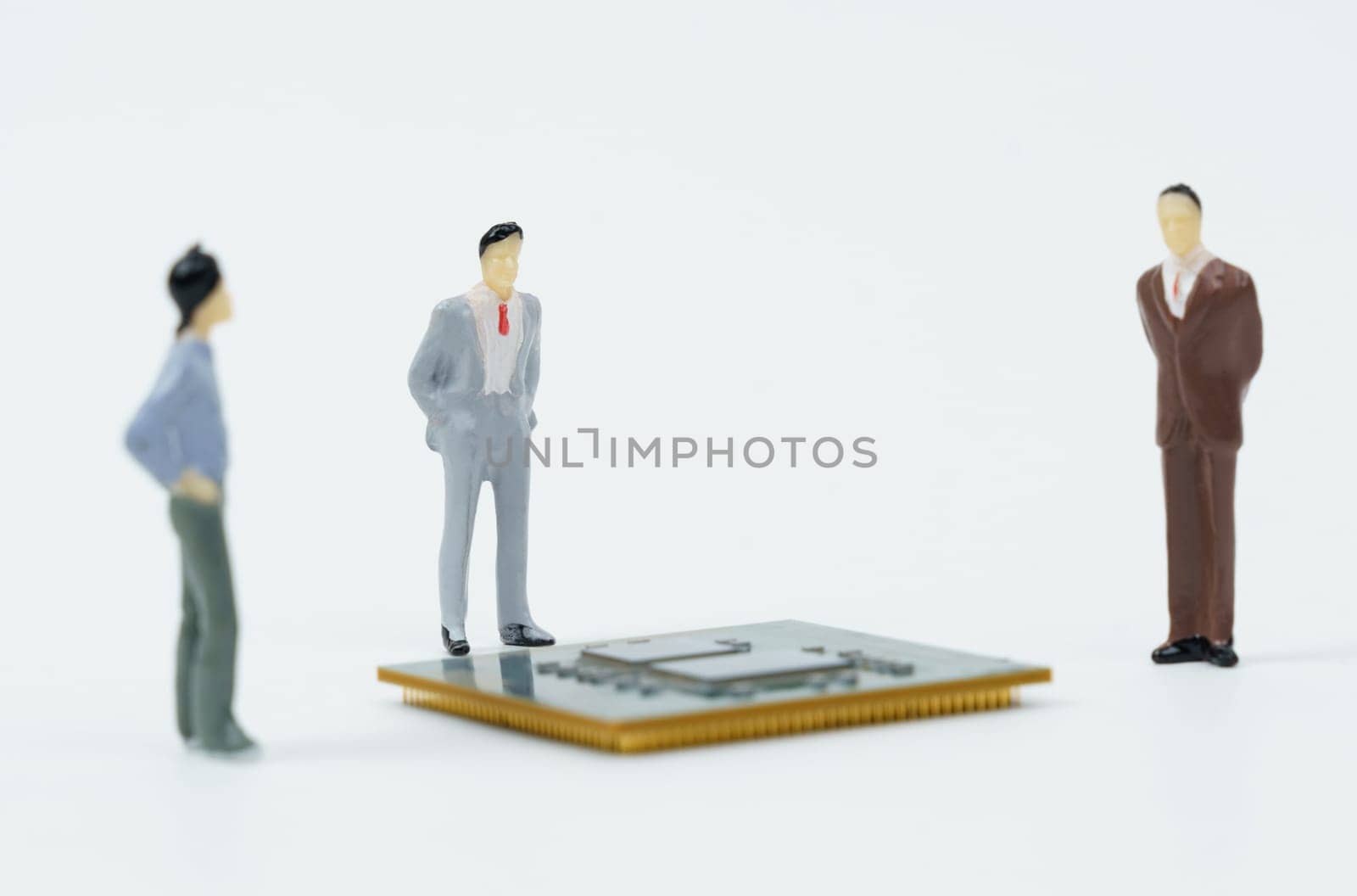 On a white surface lies a processor around which are miniature figures of people. by Sd28DimoN_1976