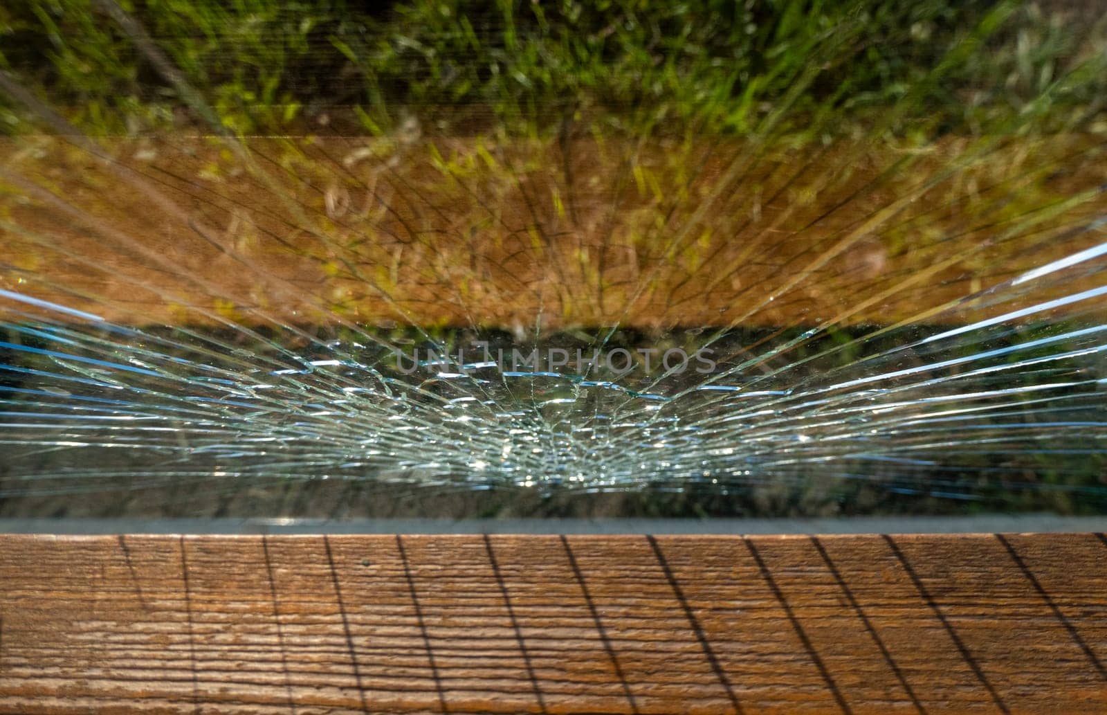 Broken glass at a street bus stop . High quality photo