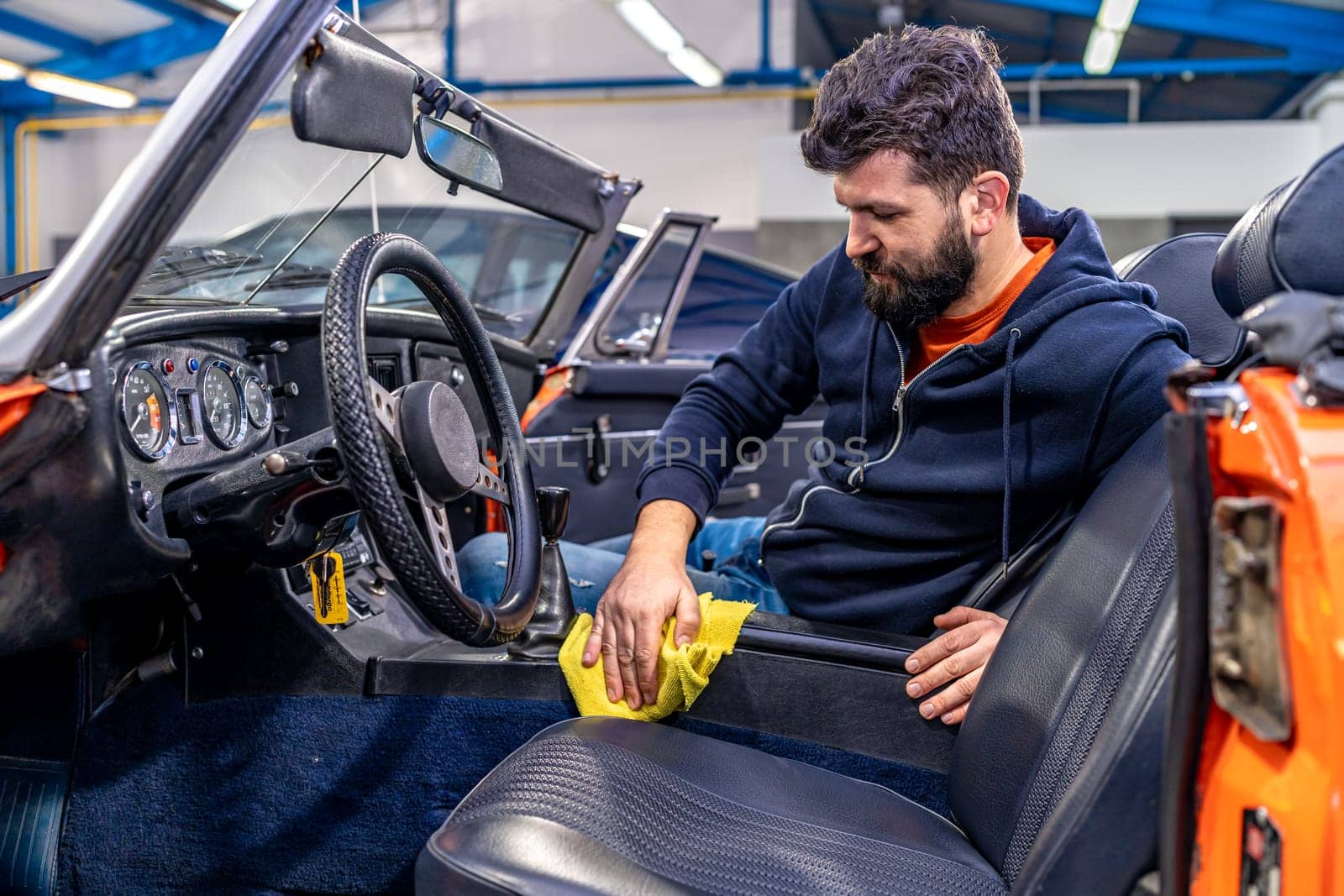 manual cleaning of the interior of an old car. High quality photo