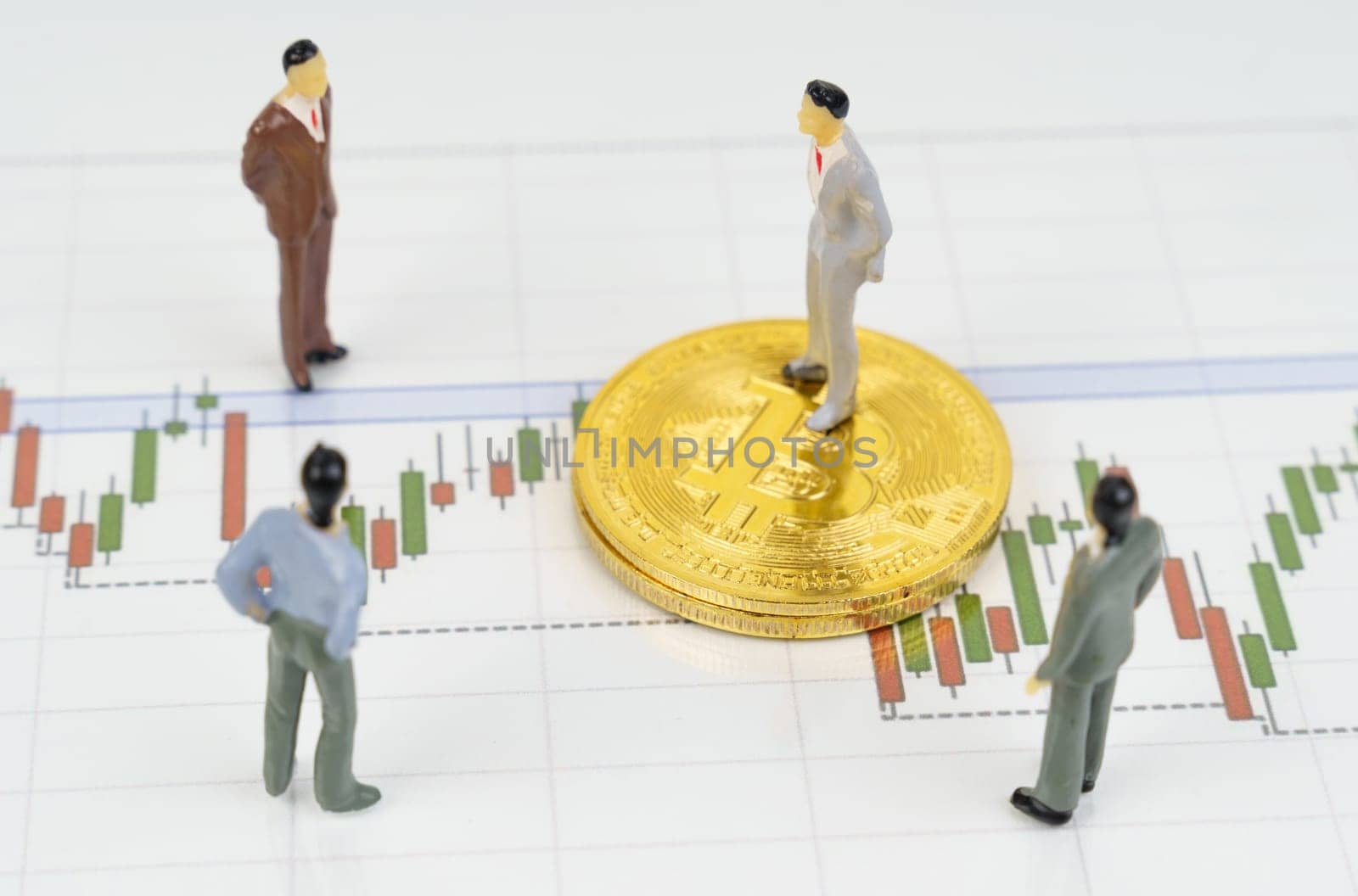 On the business charts are bitcoins and miniature figures of people. by Sd28DimoN_1976