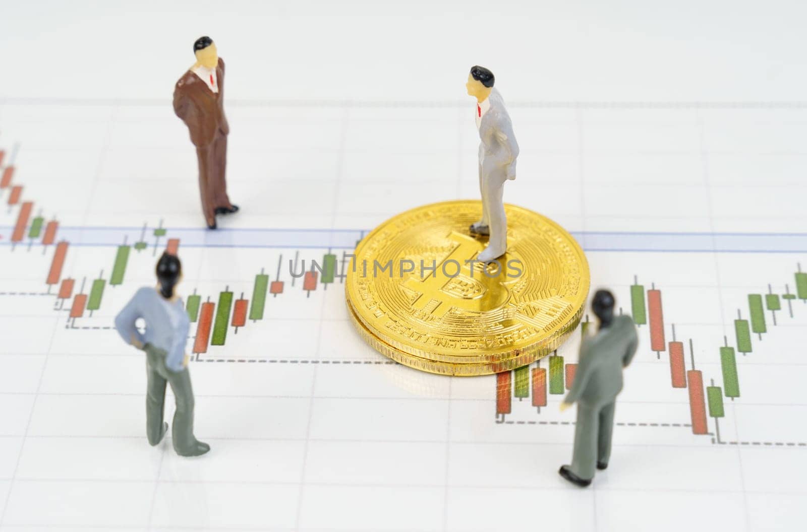 On the business charts are bitcoins and miniature figures of people. by Sd28DimoN_1976