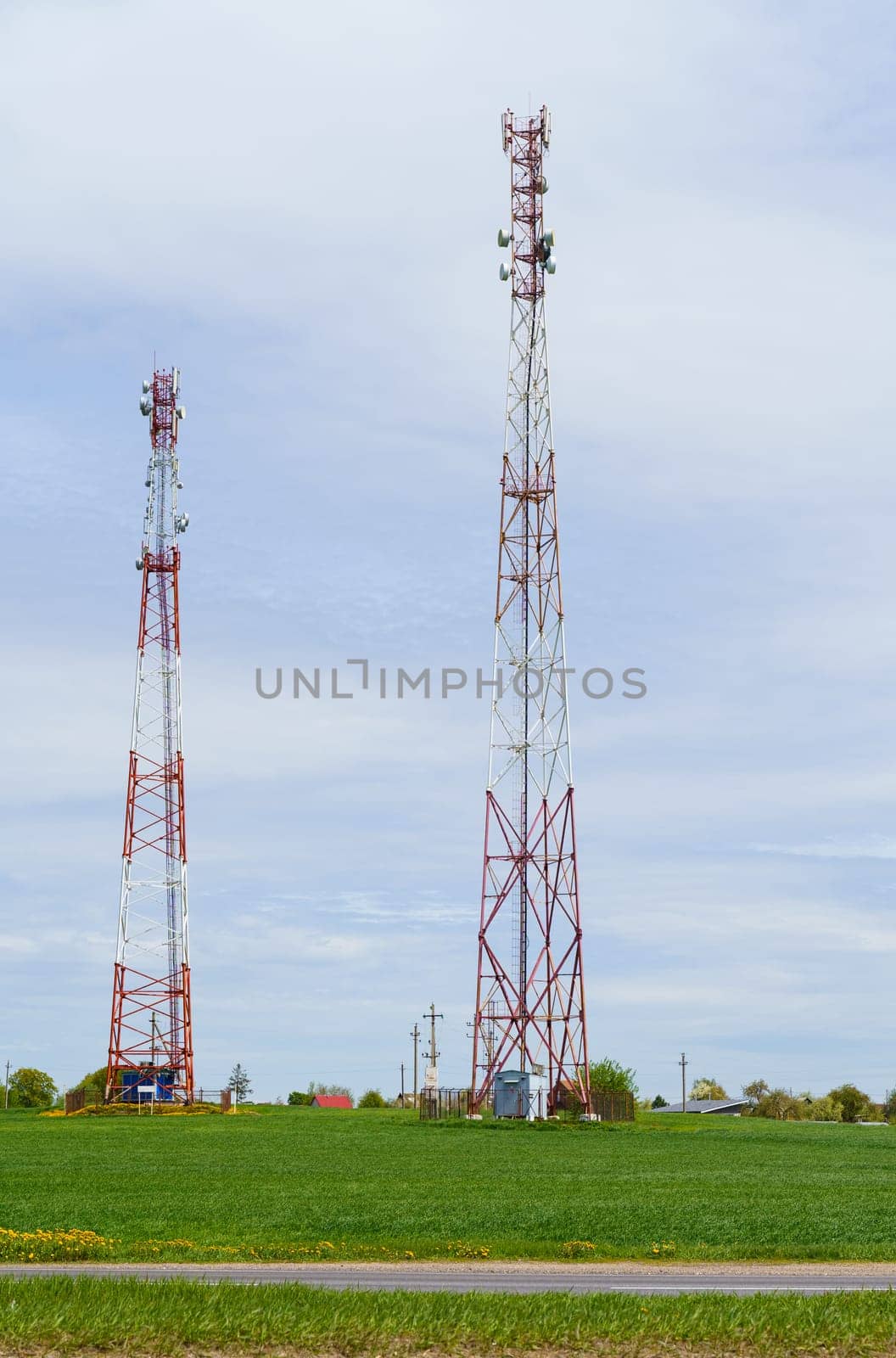 The tower-antenna of the mobile operator is in the field. Communication and telecommunications concept.
