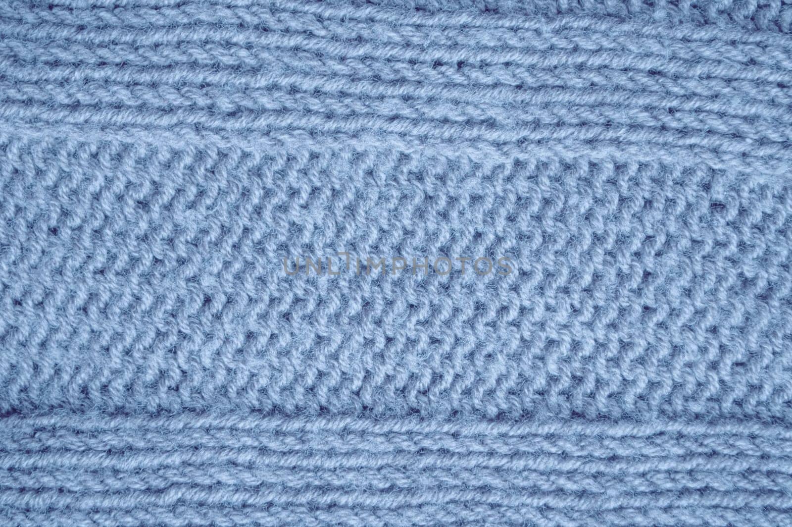 Structure Knitted Sweater. Abstract Wool Texture. Handmade Xmas Background. Knitted Blanket. Blue Macro Thread. Scandinavian Winter Plaid. Fiber Jumper Cashmere. Detail Knitted Sweater.