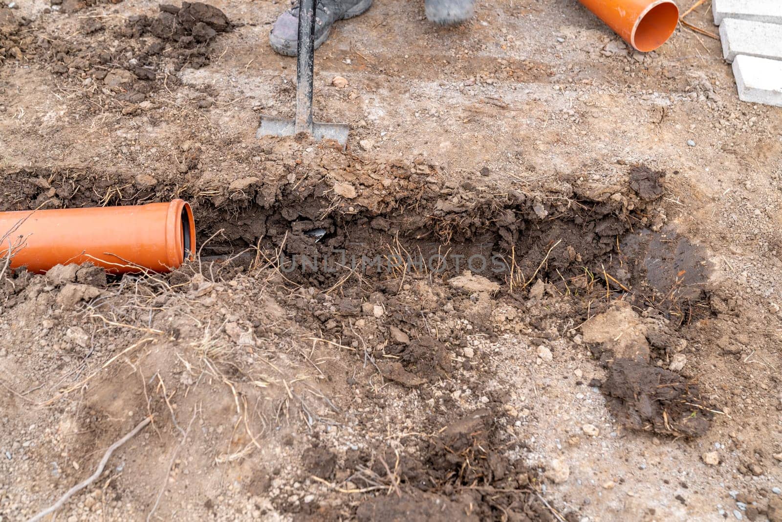 plastic pvc waste sewer pipe in the ground. High quality photo
