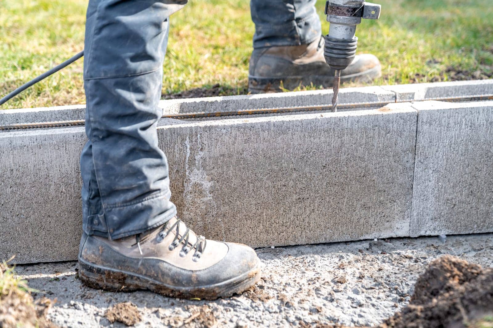 drilling of concrete foundations with an electric drill.
