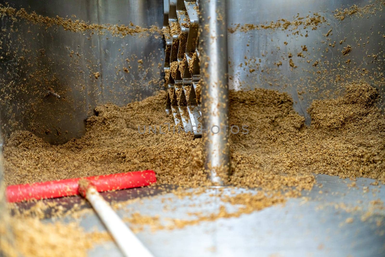 cleaning the boiler from residual malt after brewing beer in the brewery.