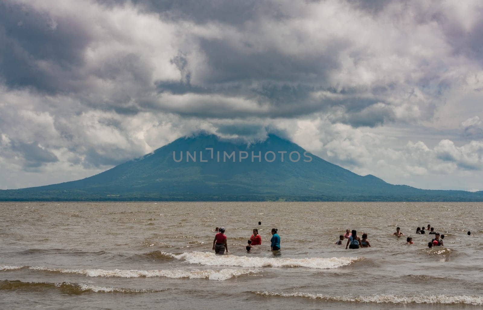 Group of people enjoying in Lake Nicaragua. Nicaraguan vacationers enjoying in lake Ometepe, Nicaragua.