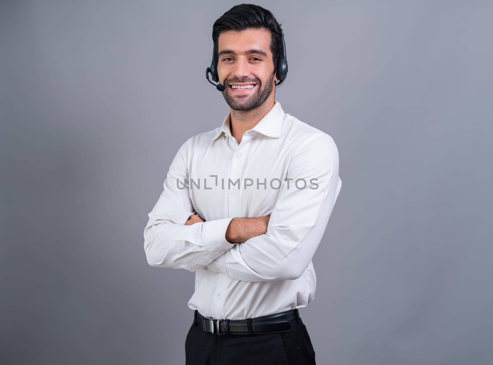 Male call center operator wearing headset and formal suit portrait. fervent by biancoblue
