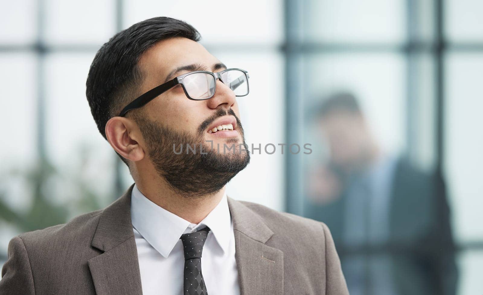 portrait of confident businessman with arms crossed