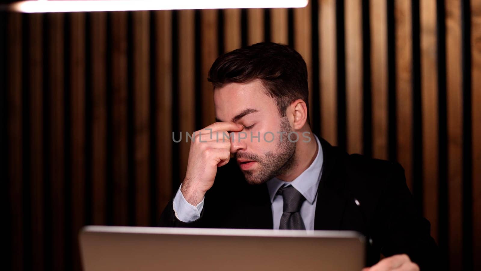 boss of the corporation looks into his laptop