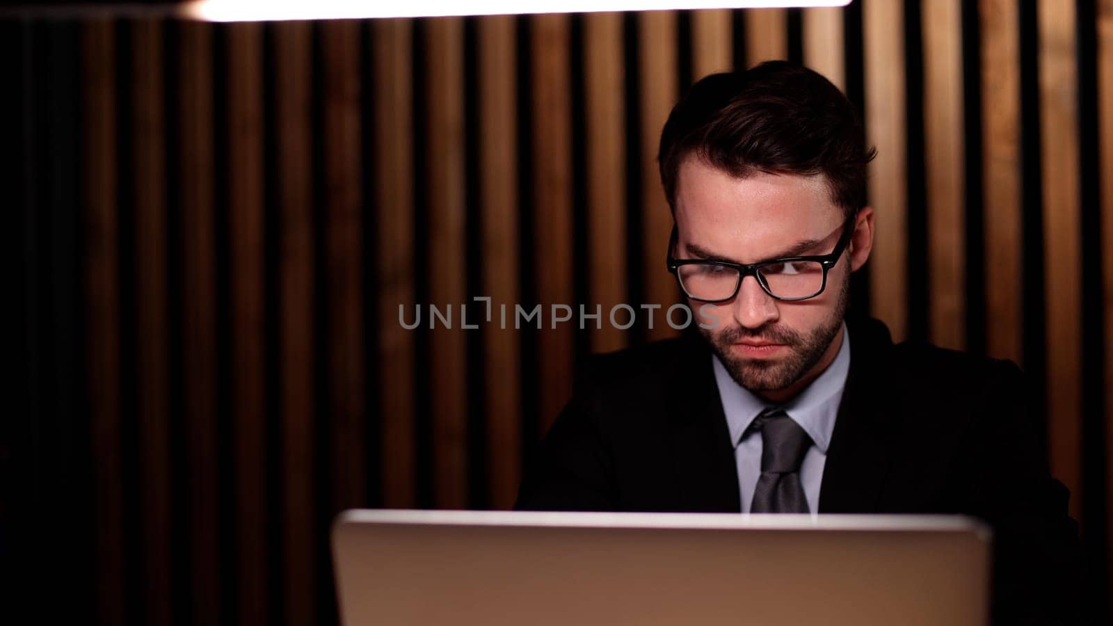boss of the corporation looks into his laptop