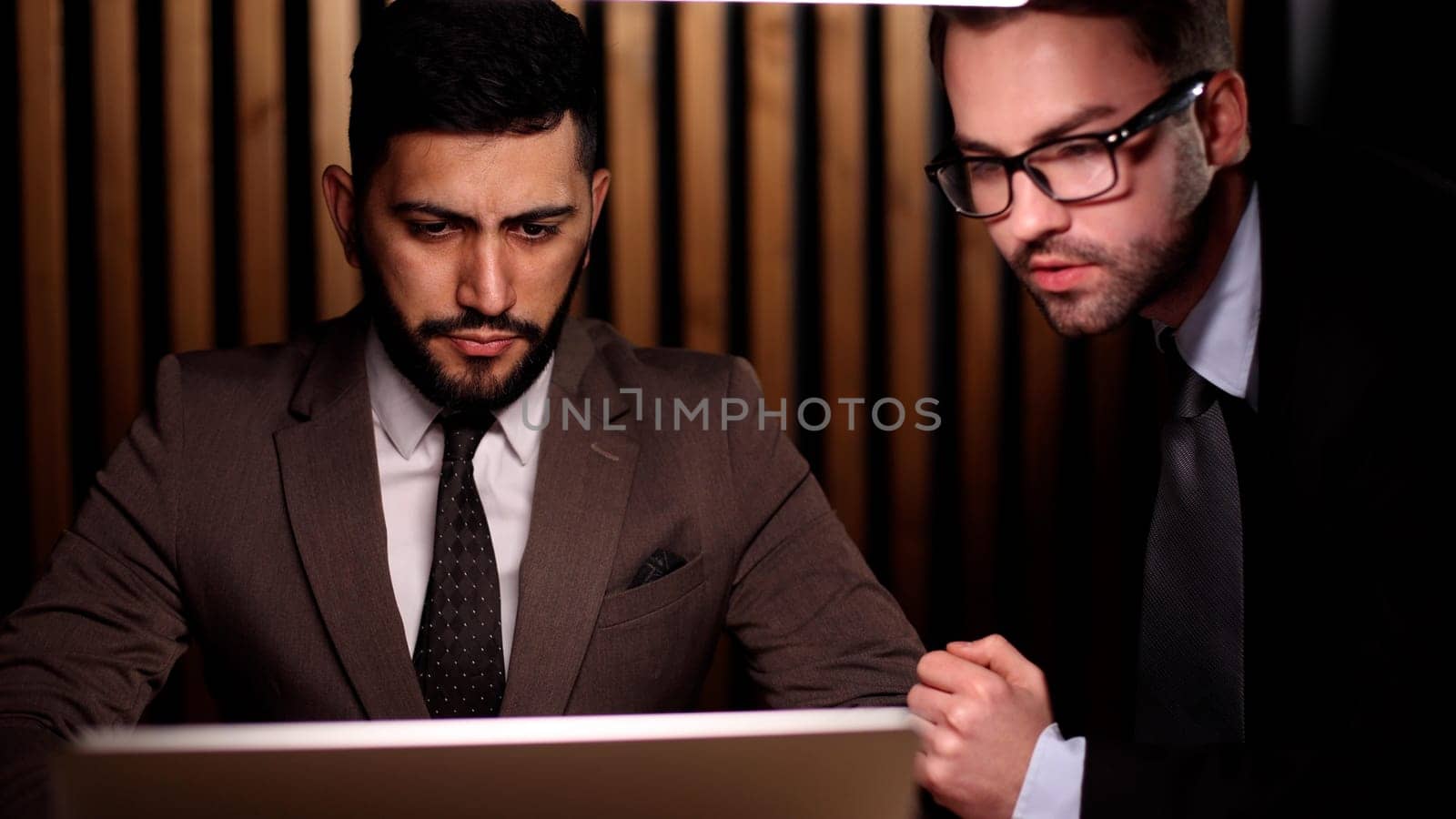 Two business men sitting in the office, meeting or job interview.