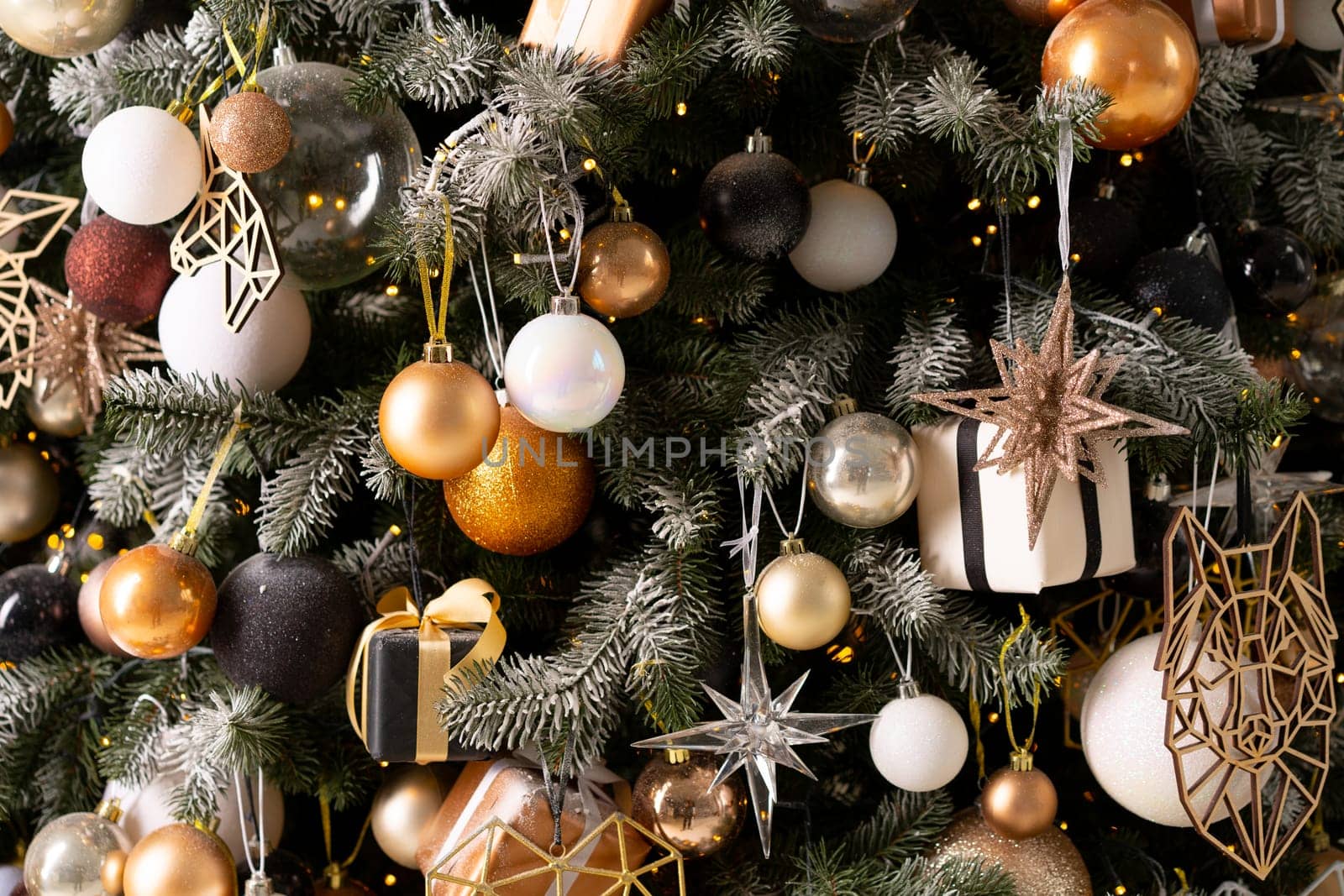 Christmas tree decoration close up background. Garland, balls, illuminated lights by andreonegin
