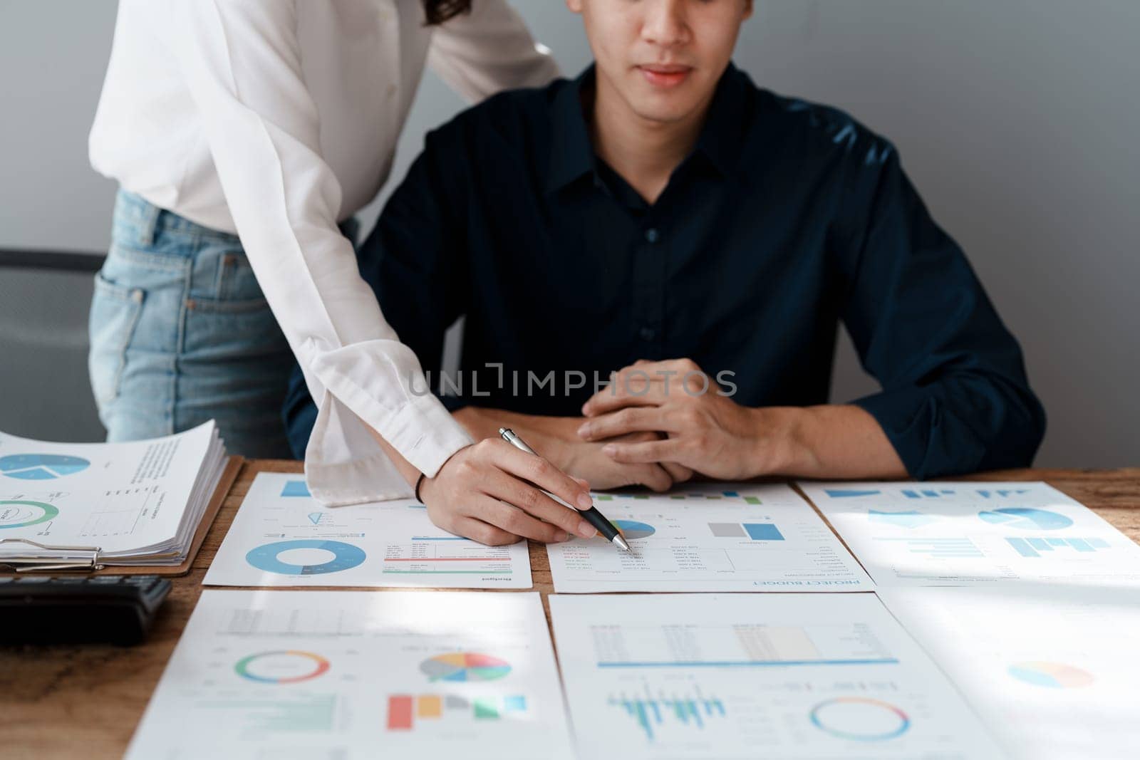 Startup family business, husband and wife discussing financial affairs, investing, making profit, tax deduction from trading using computer and investment budget paperwork working by Manastrong