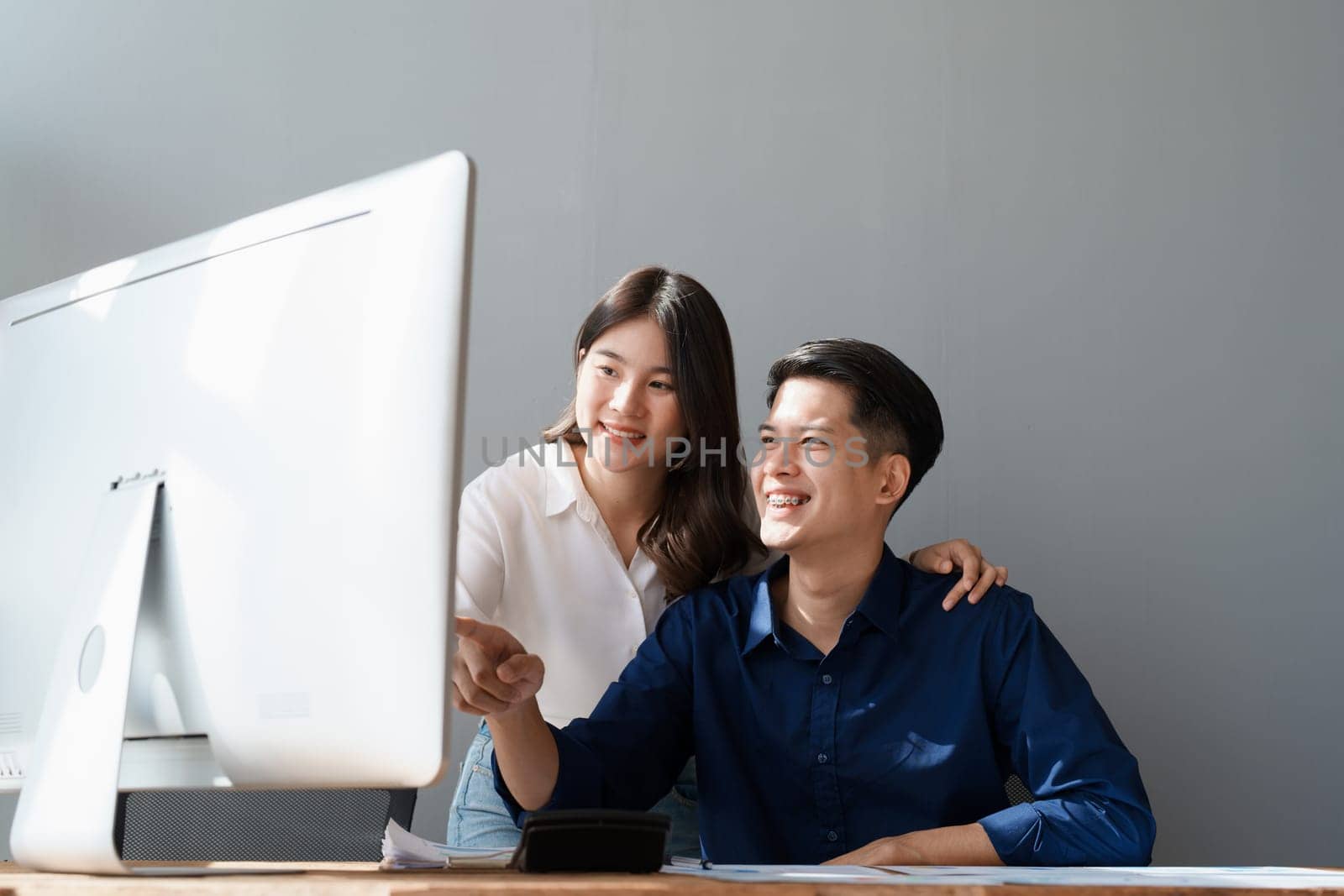 Startup family business, husband and wife discussing financial affairs, investing, making profit, tax deduction from trading using computer and investment budget paperwork working by Manastrong