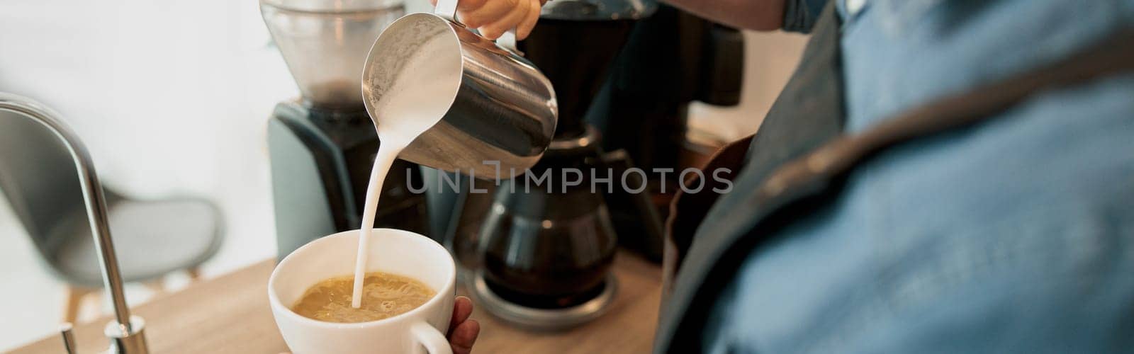 Close up of Professional barista is making fresh takeaway latte from coffee machine