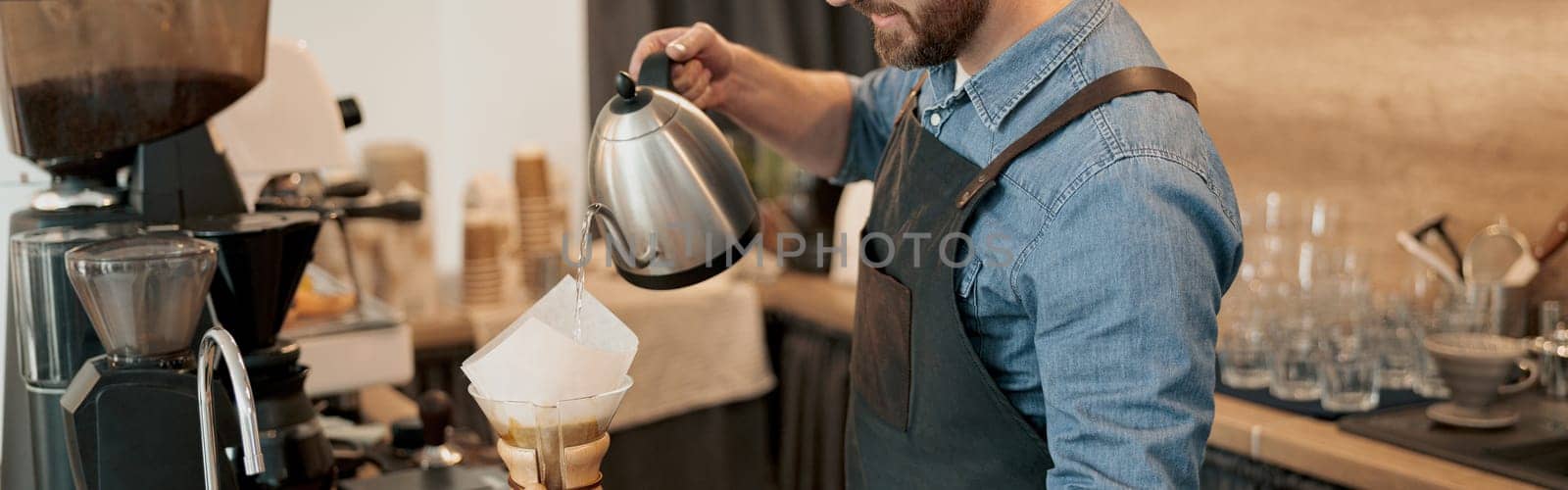 Hand drip coffee, Barista pouring water on coffee ground with filter