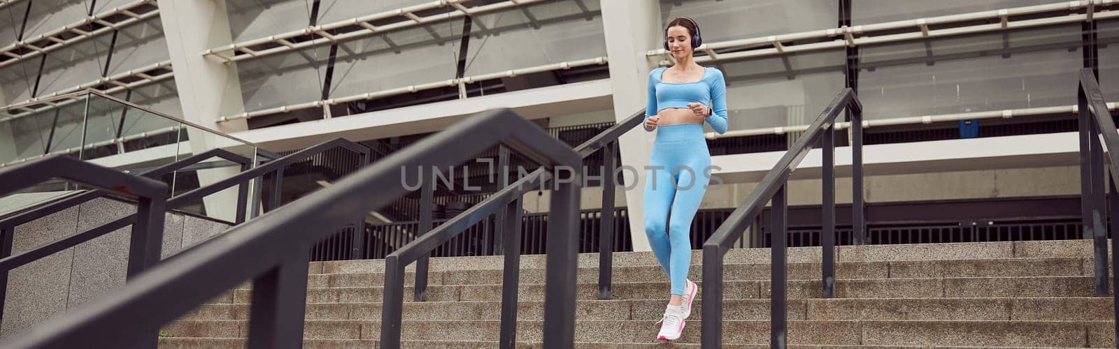 happy beautiful caucasian woman at workout in urban city