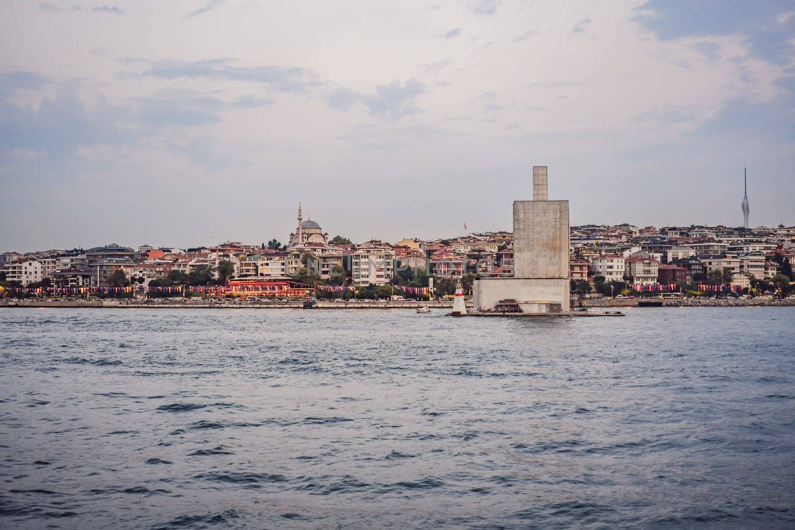 Kiz Kulesi or Maiden's Tower under reconstruction in Istanbul. Travel to Istanbul background vertical photo. landmarks of Turkey by galitskaya