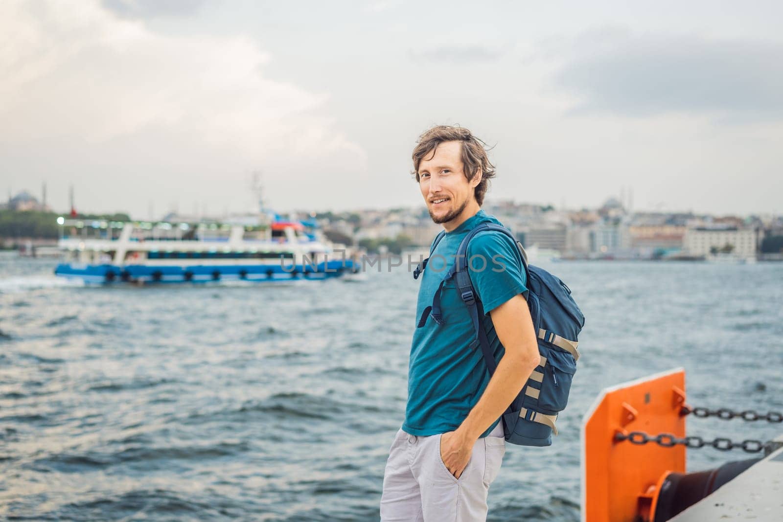 Man tourist enjoying Galataport area view, cruise port of Istanbul newly opening in 2021, located in the shores of the Galata, Karakoy in Istanbul.