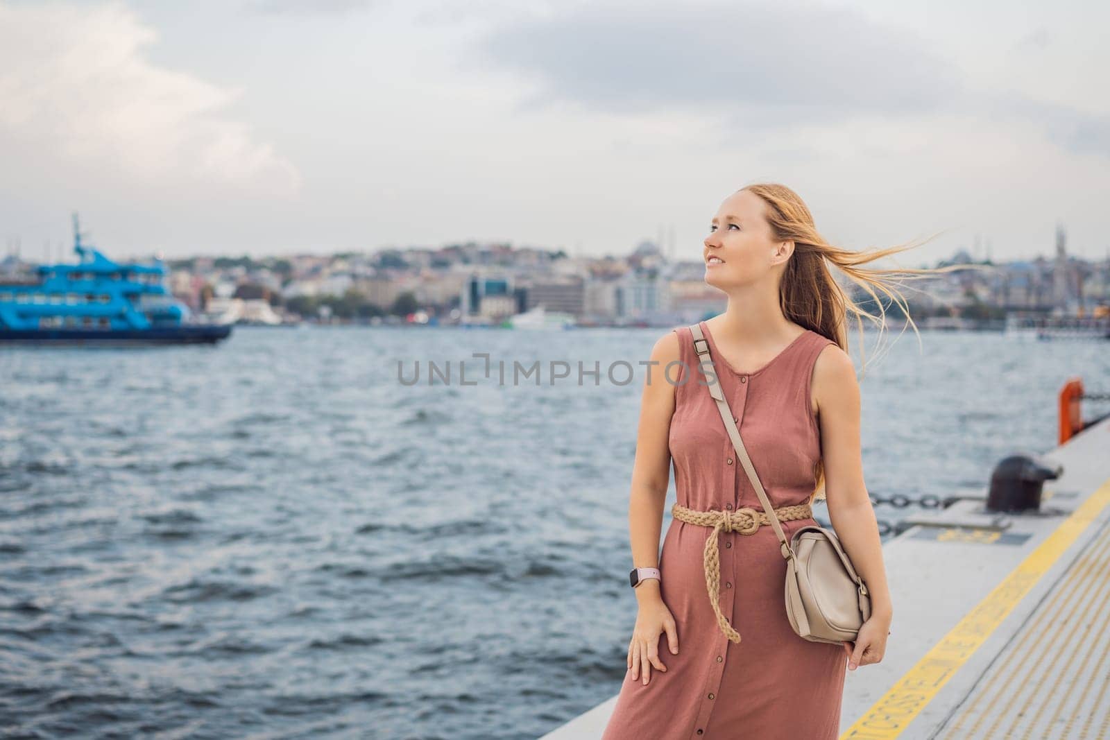 Woman tourist enjoying Galataport area view, cruise port of Istanbul newly opening in 2021, located in the shores of the Galata, Karakoy in Istanbul.
