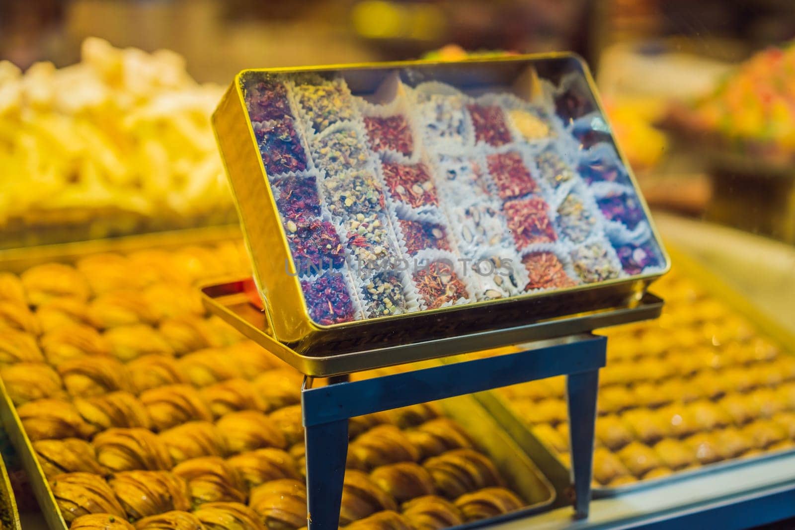 Traditional oriental sweet pastry cookies, nuts, dried fruits, pastilles, marmalade, Turkish desert with sugar, honey and pistachio, in display at a street food market by galitskaya