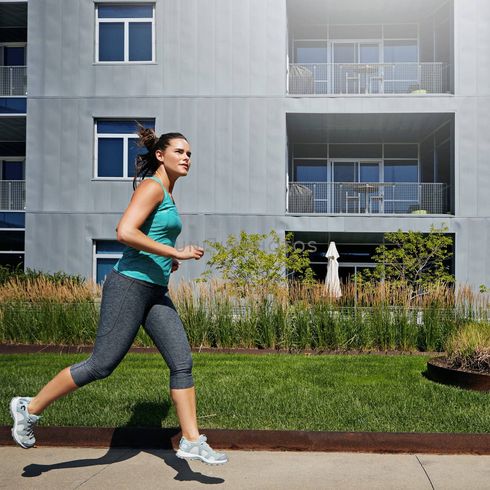 Exploring a new city through running. an attractive young female runner exercising outdoors