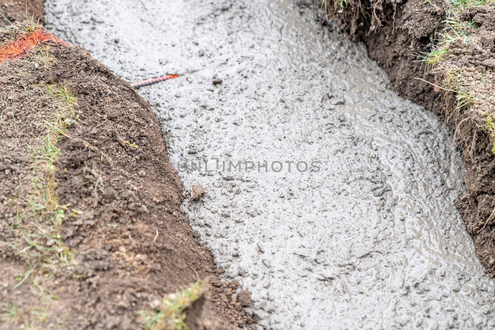 concrete foundation in the ground for building construction.