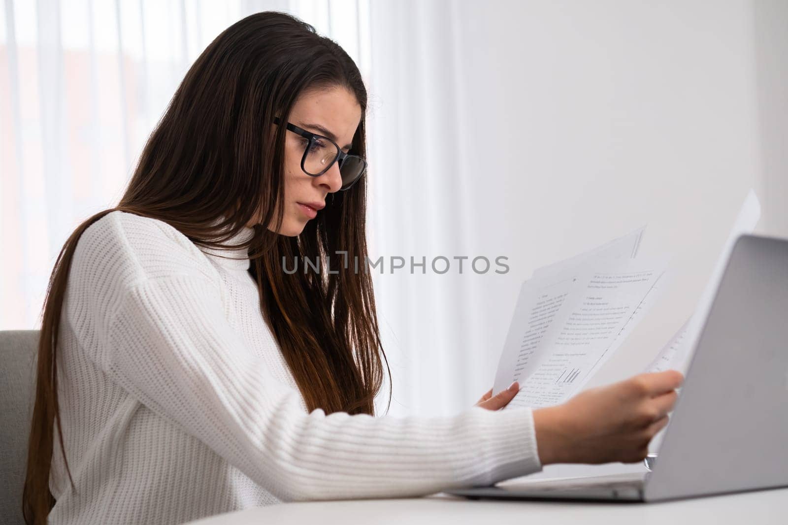 Busy business woman working with documents and notebook