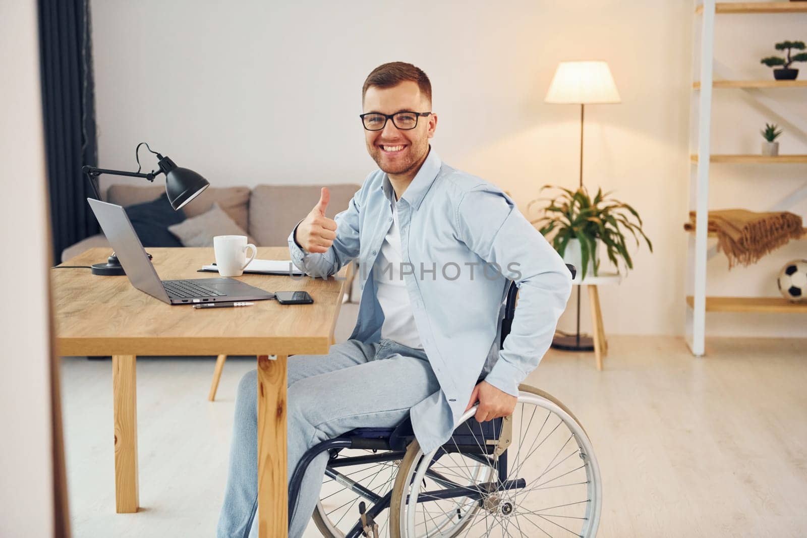Working on a project from home. Disabled man in wheelchair.