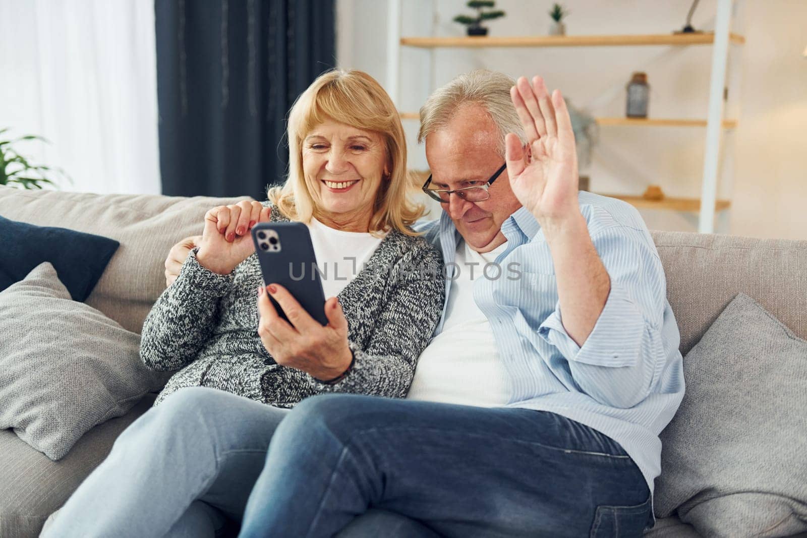 Happy together. Senior man and woman is at home by Standret