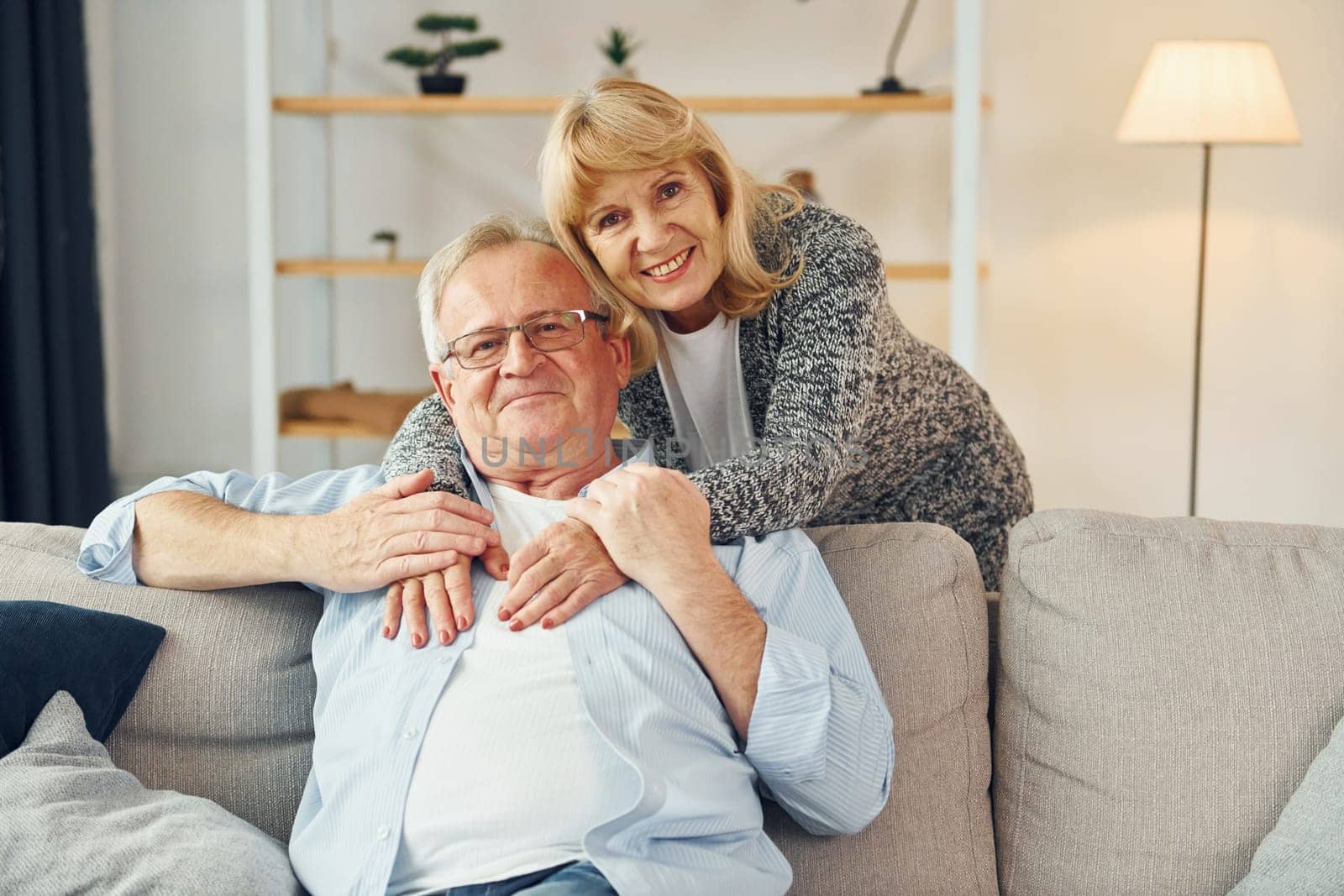 Happy together. Senior man and woman is at home.