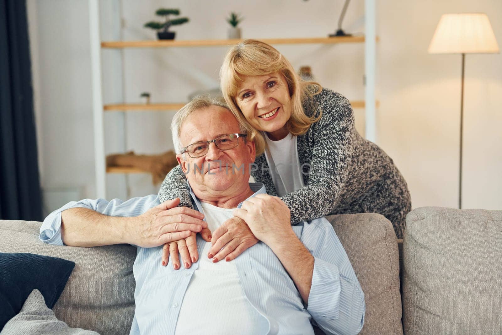 Happy together. Senior man and woman is at home.