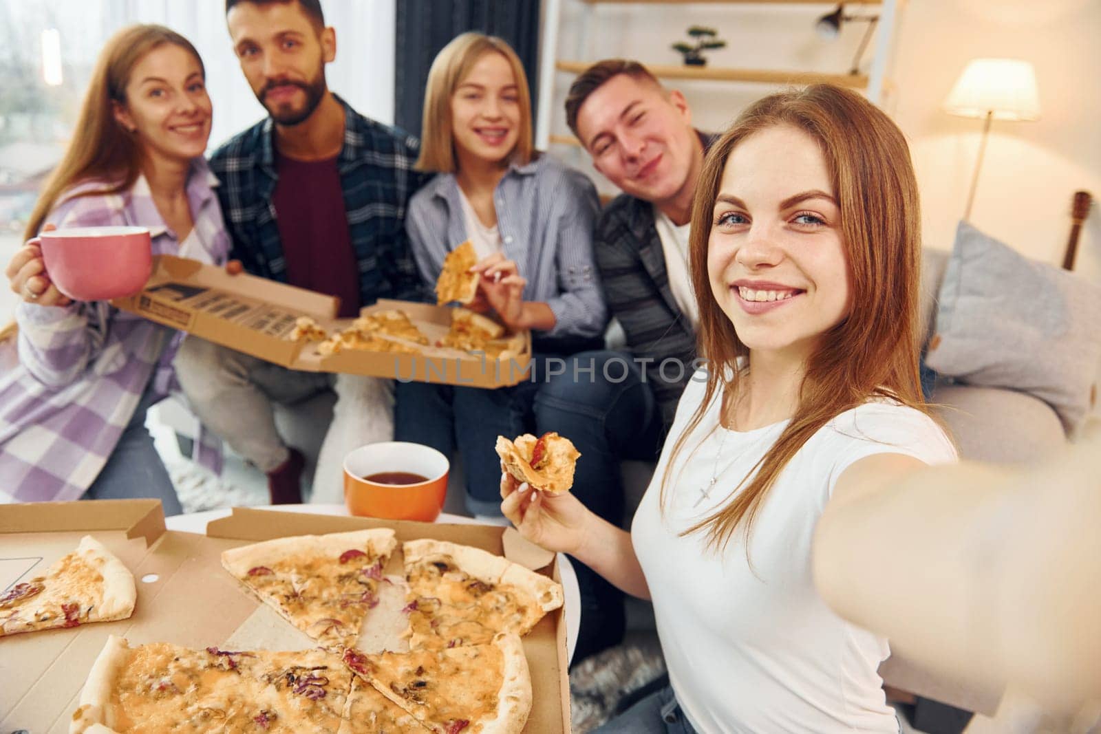 Selfie photo. Group of friends have party indoors together.