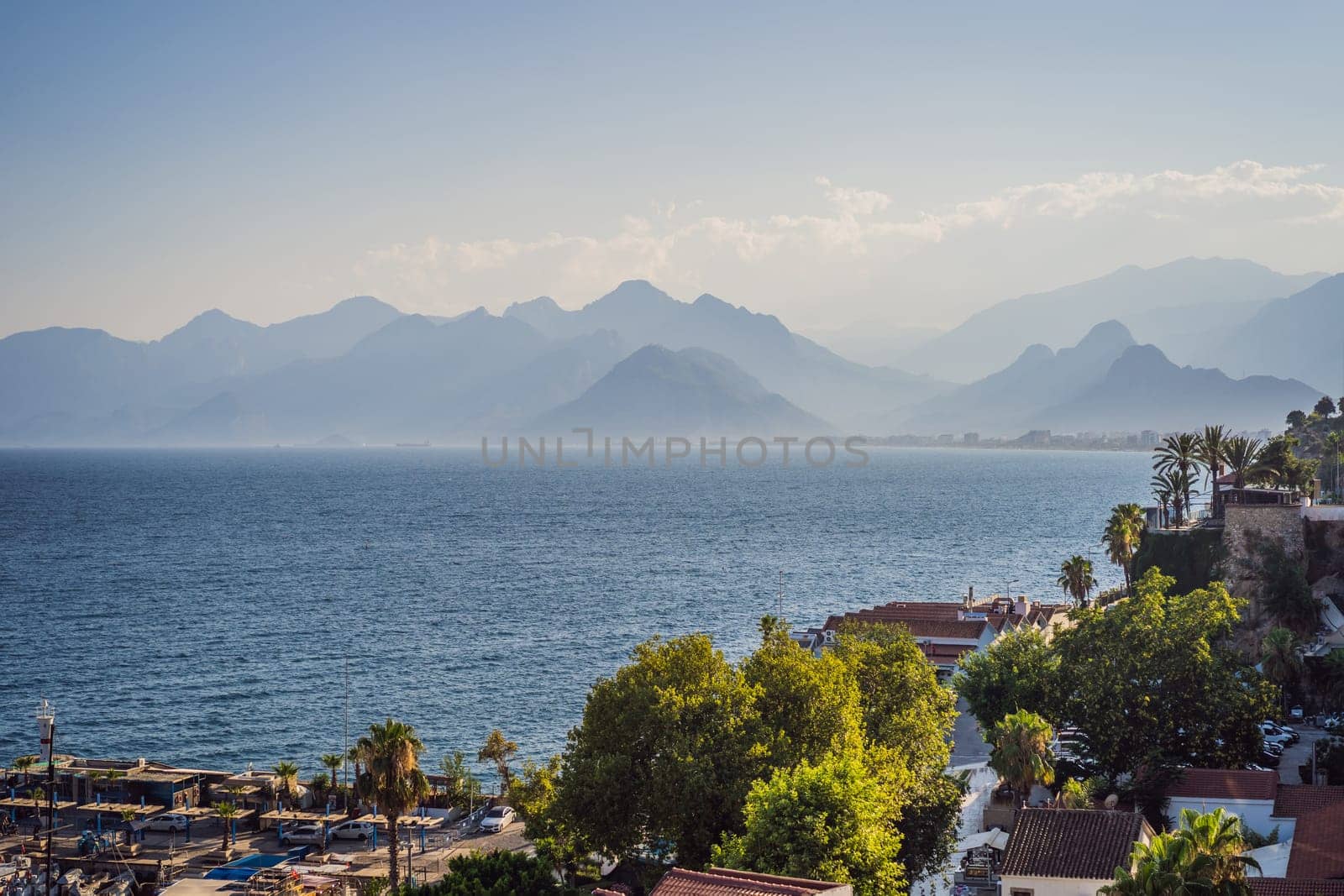 Old town Kaleici in Antalya. Panoramic view of Antalya Old Town port, Taurus mountains and Mediterrranean Sea, Turkey.