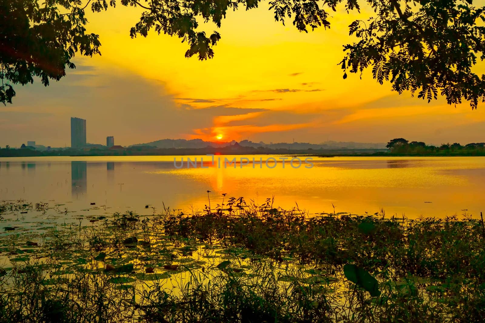 Beautiful view of Waduk Bunder or Water Dam Bunder in Gresik, East Java, Indonesia during sunrise and cloudy wheater.