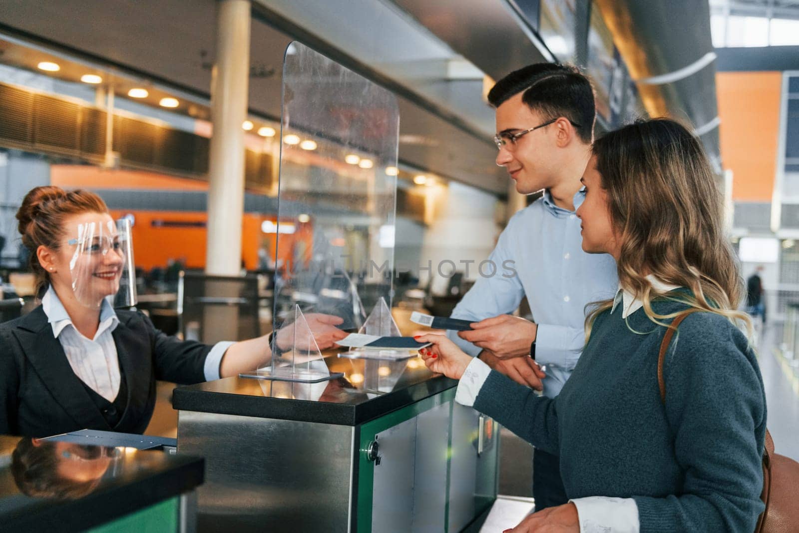 Professional service. Young couple is in the airport together.