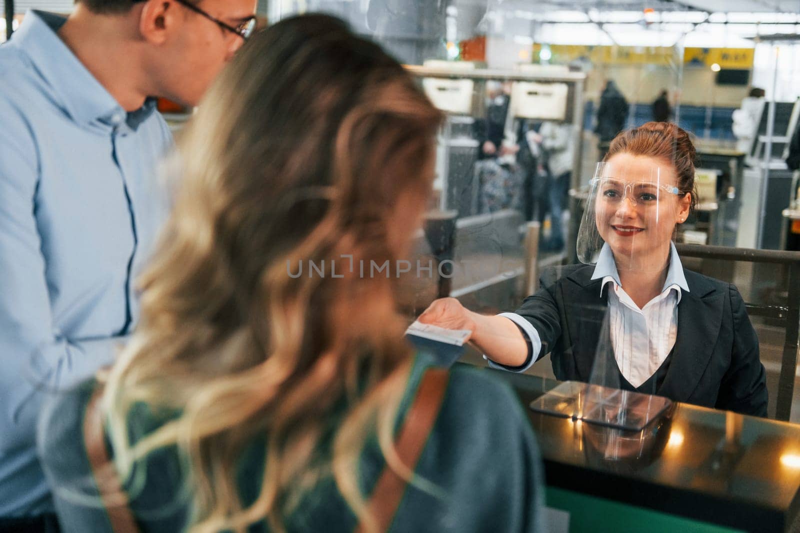 Professional service. Young couple is in the airport together.