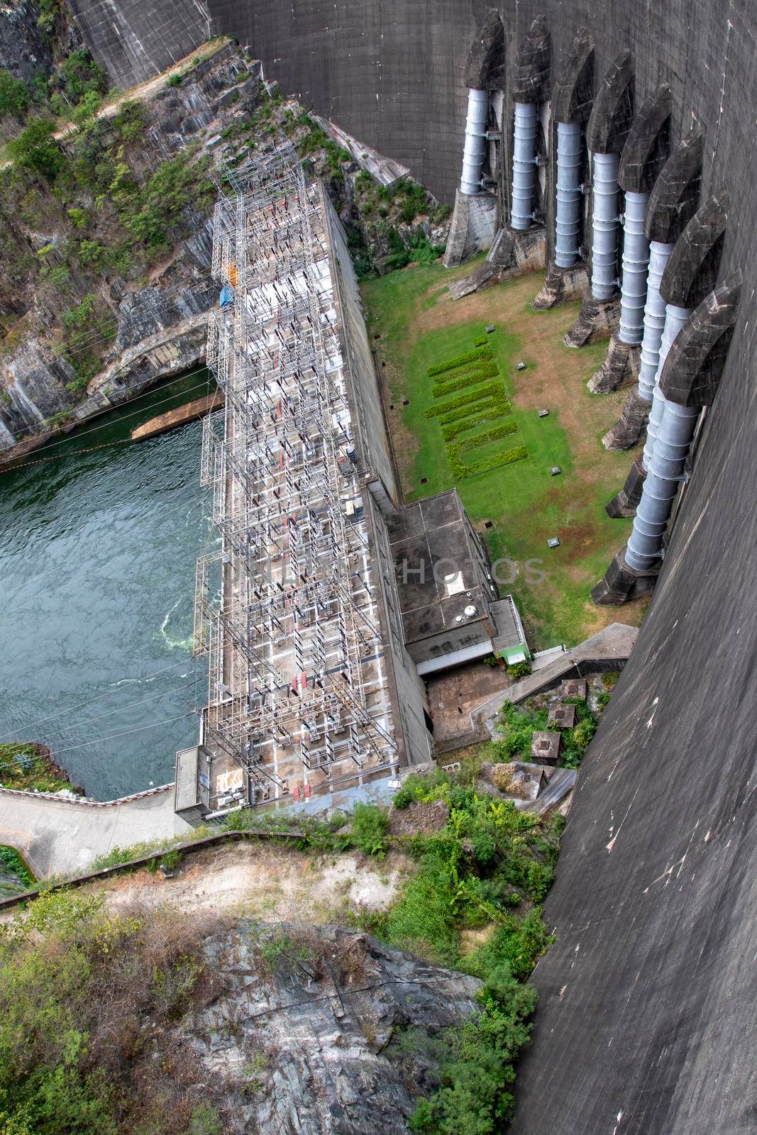 Image of view of bhumibol dam in tak Thailand. Hydro Power Electric Dam and is the first multipurpose dam in thailand and is water storage for agriculture and electricity.. The curved concrete dam. by yod67