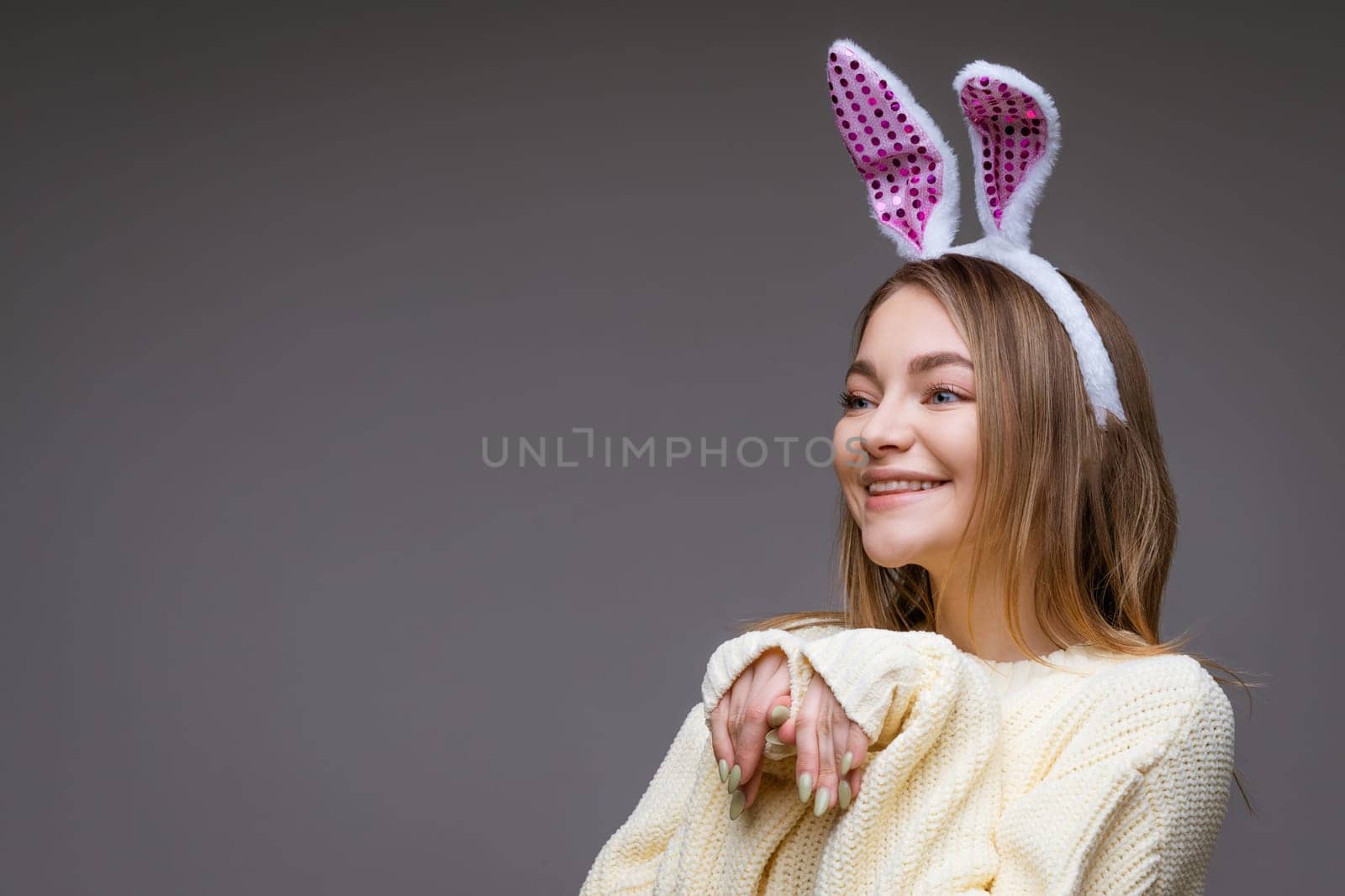 portrait of a cute girl with bunny ears on a gray background by EkaterinaPereslavtseva