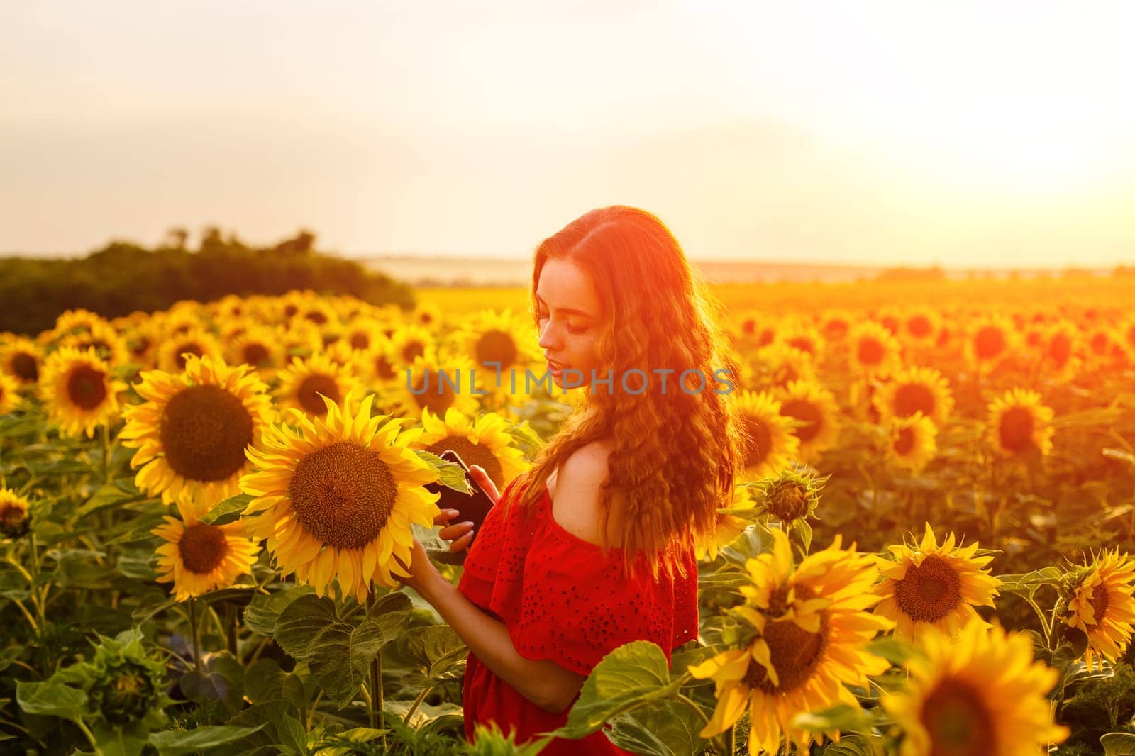 Female portrait of young woman in field of blooming by EkaterinaPereslavtseva