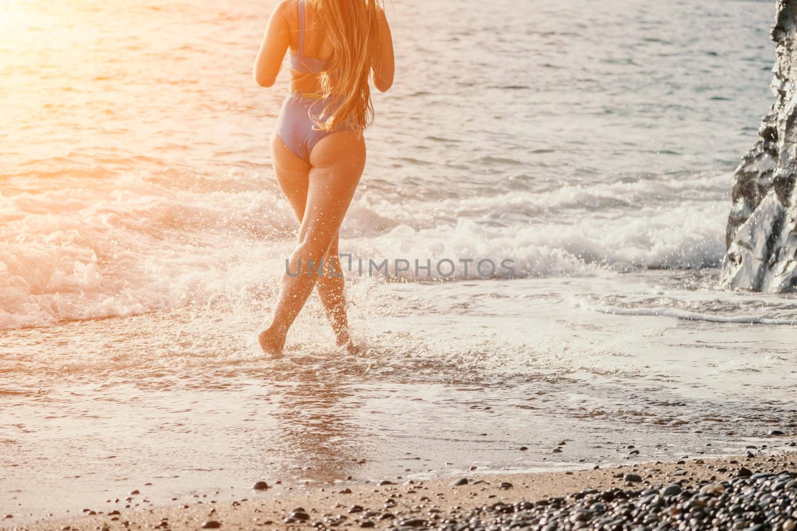 Running woman. Female runner jogging during the sunrise on beach. Woman Runner feet running on the beach at sunrise. woman fitness sunrise jog workout wellness concept.