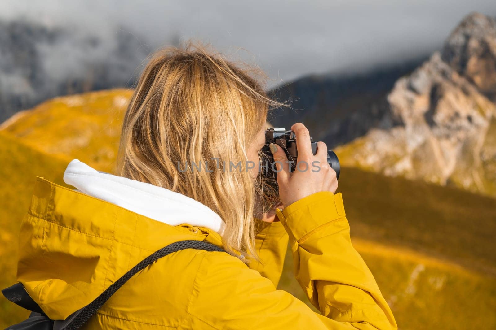 Travel photographer takes photos of Dolomites Alps