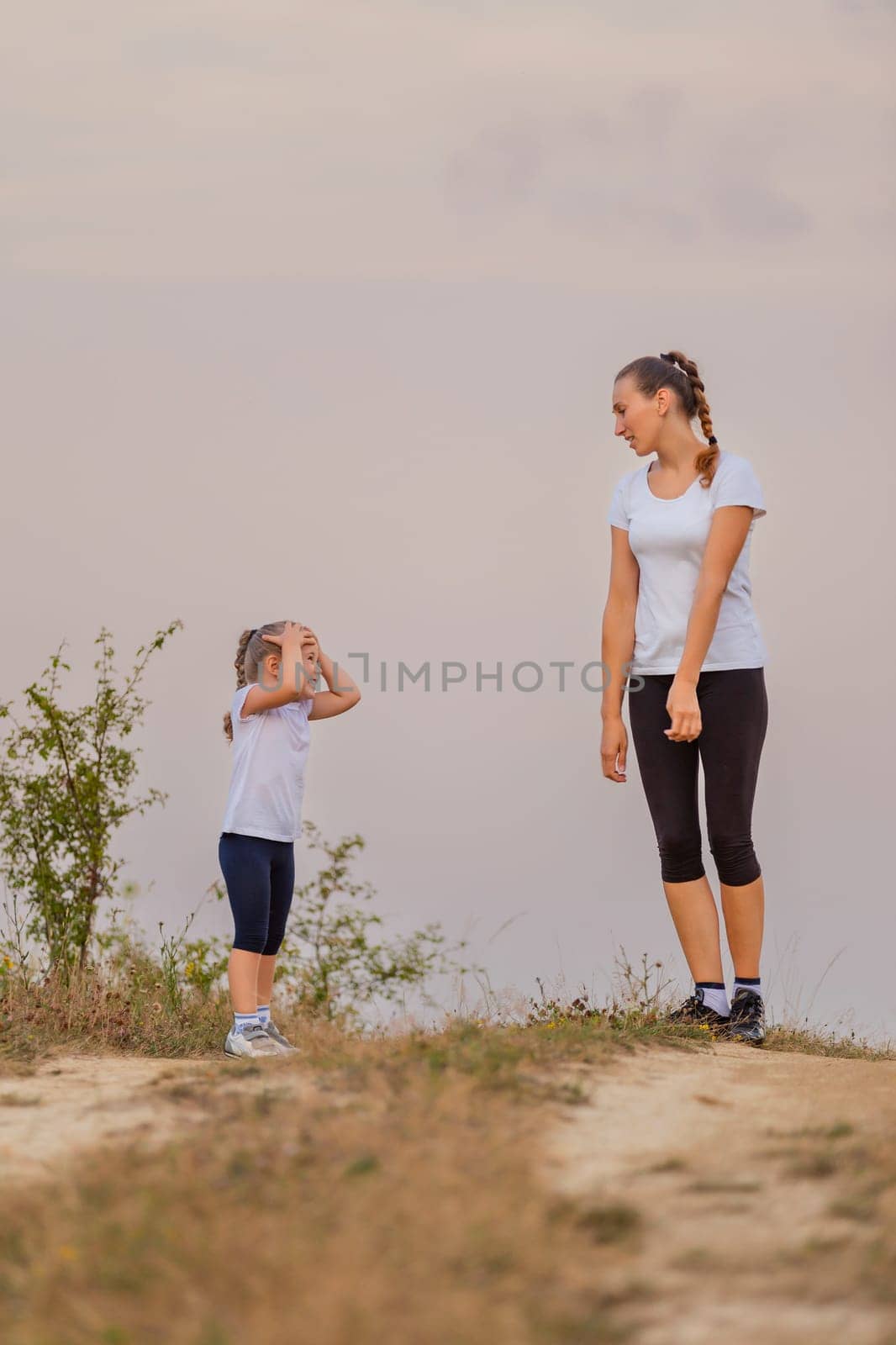 mother and daughter walking by zokov